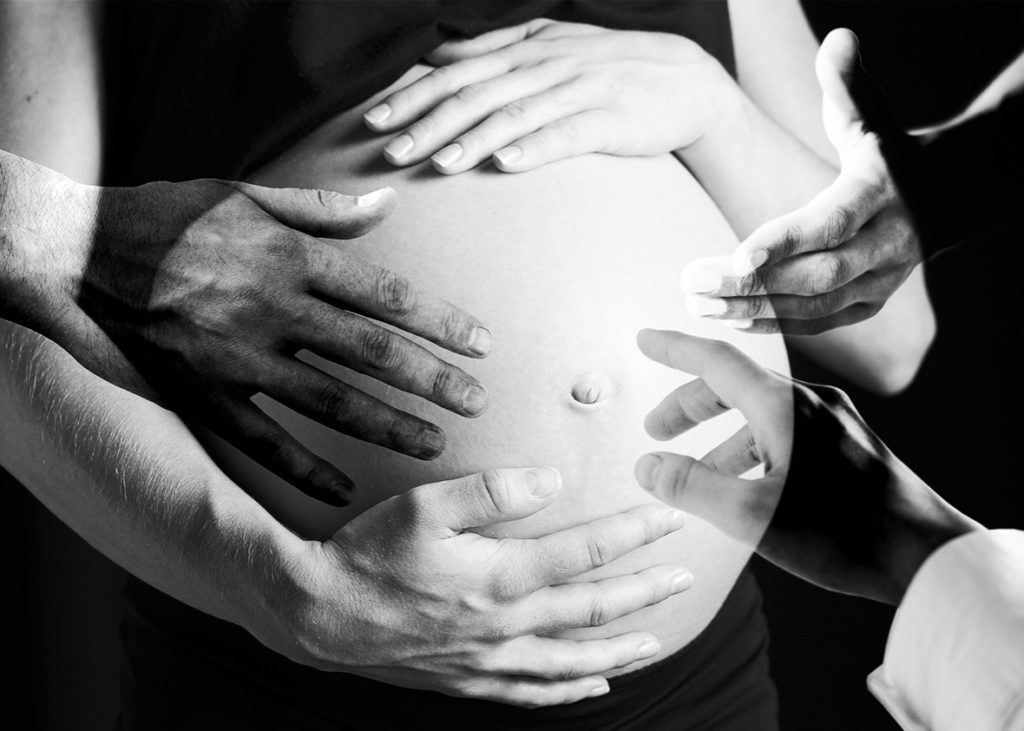 There are many hands want to touch pregnant mother's belly - Joy of Life Surrogacy