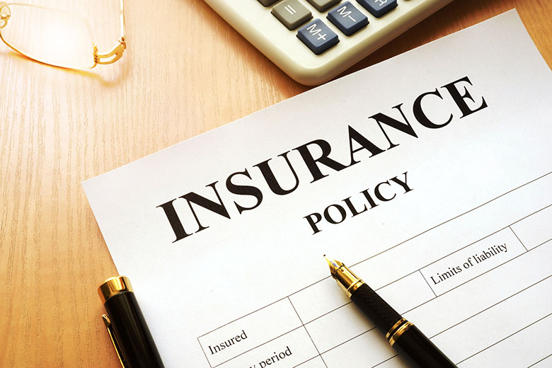 Insurance policy on a desk - Joy of Life Surrogacy
