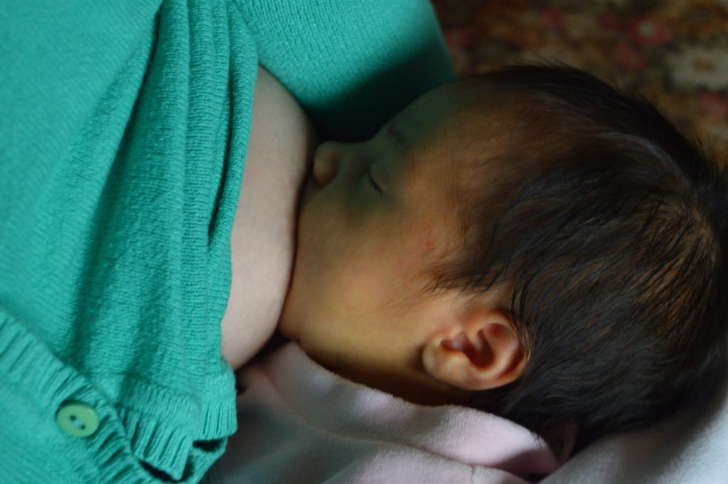 baby breastfeeding during daytime - Joy of Life Surrogacy